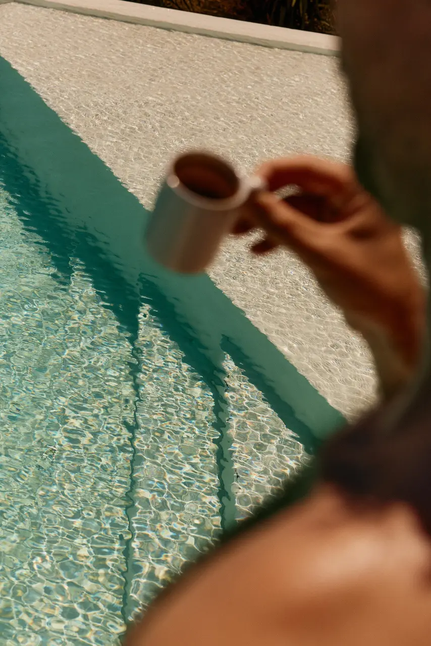 Sunlight and ripples reflected across clear blue water
